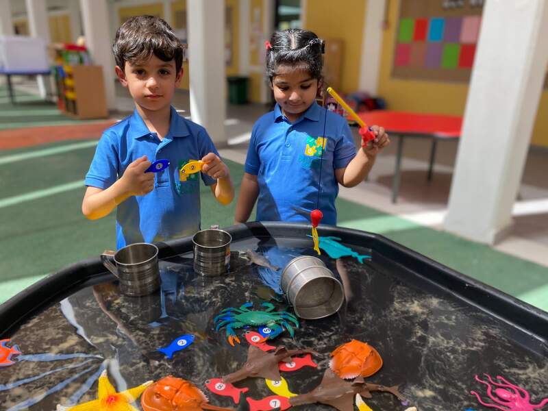 Two Bright Learners students play in the school